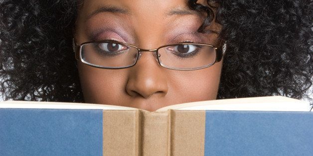 black woman reading book