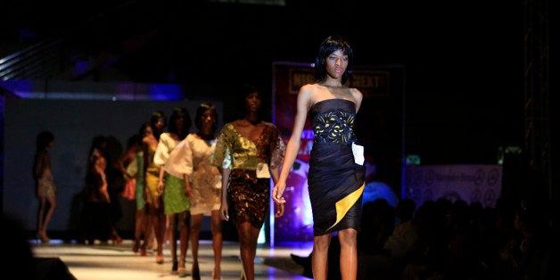 Models display outfits by designer Deola Sagoe during Nigeria's Next Top Supermodel competition in Lagos, Nigeria, Sunday, Nov. 24, 2013. The models are competing in this year's televised supermodel competition, as they try to win the top prize of a luxury car and a modeling contract which will sweep the winner away to an international modeling career. (AP Photo/Sunday Alamba)