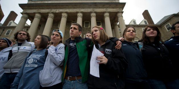 STATE COLLEGE, PA - NOVEMBER 10: Penn State students gather at Old Main, at the center of Penn State University's campus, to express solidarity with the alleged rape victims following a night of rioting in response to the firing of head football coach Joe Paterno in the wake of the Jerry Sandusky scandal November 10, 2011 in State College, Pennsylvania. 14,000 students took to the streets to express their feelings about the handling of the situation. Paterno was fired amid allegations that former former Penn State defensive coordinator Jerry Sandusky was involved with child sex abuse. (Photo by Jeff Swensen/Getty Images)