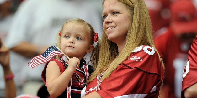 GLENDALE, AZ - SEPTEMBER 11: An Arizona Cardinals fan and her daugher show their patriotism prior to the game between the Carolina Panthers and Arizona Cardinals in the NFL season opening game at the University of Phoenix Stadium on September 11, 2011 in Glendale, Arizona. Arizona won 28-21. (Photo by Norm Hall/Getty Images)