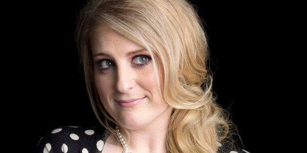 American singer, songwriter and record producer known for the pop single "All About That Bass" Meghan Trainor poses for a portrait, on Thursday, August 7, 2014 in New York. (Photo by Amy Sussman/Invision/AP)
