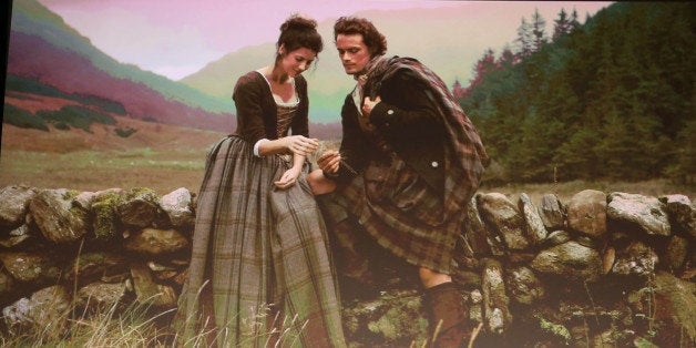 From left, Alicia Quarles, Ronald D. Moore, Diana Gabaldon, Caitriona Balfe, and Sam Heughan are seen onstage at the STARZ "O