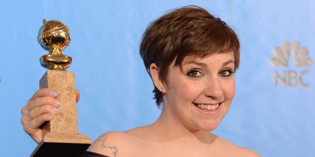 Lena Dunham poses in the press room with her Best performance by an actress in a television comedy or musical series award for 'Girls' at the Golden Globes awards ceremony in Beverly Hills on January 13, 2013. AFP PHOTO/Robyn BECK (Photo credit should read ROBYN BECK/AFP/Getty Images)