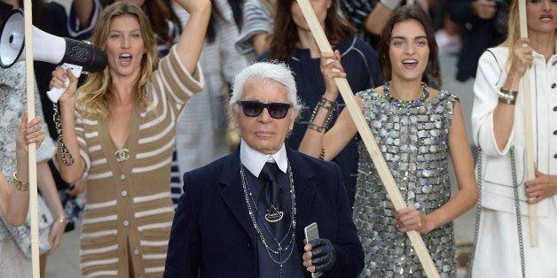 PARIS, FRANCE - SEPTEMBER 30: Fashion designer Karl Lagerfeld (C) aknowledges the applause of the audience after the Chanel show as part of the Paris Fashion Week Womenswear Spring/Summer 2015 on September 30, 2014 in Paris, France. (Photo by Dominique Charriau/WireImage)