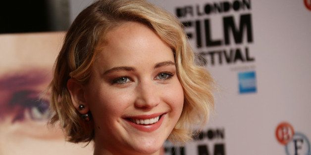 Actress Jennifer Lawrence poses for photographs during the photo call for the film Serena, as part of London Film Festival, at the Vue cinema in central London, Monday, Oct. 13, 2014. (Photo by Joel Ryan/Invision/AP)