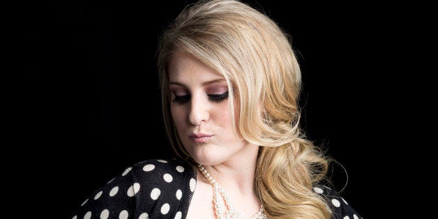 American singer, songwriter and record producer known for the pop single "All About That Bass" Meghan Trainor poses for a portrait, on Thursday, August 7, 2014 in New York. (Photo by Amy Sussman/Invision/AP)