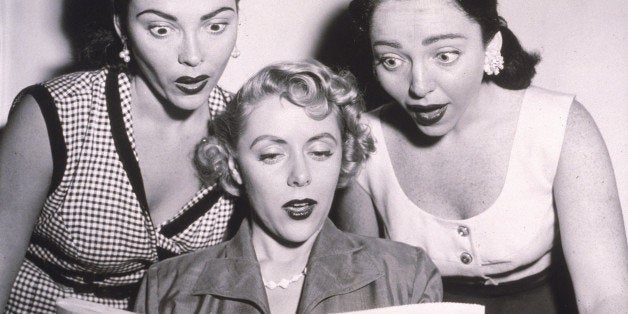 Three women (Claire Barry, Beverly Lawrence and Merna Barry) react with shock as they read a newspaper review about the Kinsey Report on female sexual behavior, 1950s. (Photo by Hulton Archive/Getty Images)