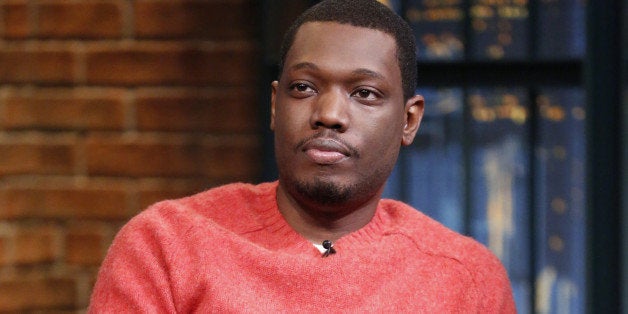 LATE NIGHT WITH SETH MEYERS -- Episode 104 -- Pictured: Comedian Michael Che during an interview on September 29, 2014 -- (Photo by: Lloyd Bishop/NBC/NBCU Photo Bank via Getty Images)