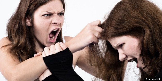two women fighting and screaming