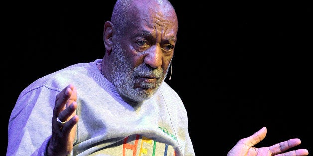 In this Nov. 21, 2014 photo, comedian Bill Cosby performs during a show at the Maxwell C. King Center for the Performing Arts in Melbourne, Fla. Tamara Green filed a defamation lawsuit against Cosby Wednesday, Dec. 10, 2014, in federal court in Springfield, Mass. In the lawsuit she claims Cosby drugged and raped her in the 1970's when she was an aspiring model. Green first spoke publicly about the alleged rape in 2005. Cosby, who has a home in Shelburne Falls in western Massachusetts, is the lawsuit's only defendant. (AP Photo/Phelan M. Ebenhack)