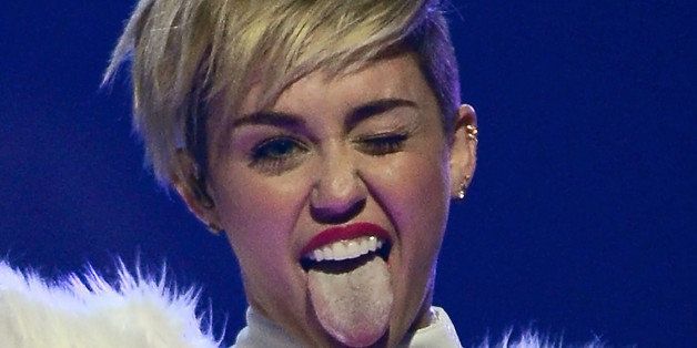 LAS VEGAS, NV - SEPTEMBER 21: Entertainer Miley Cyrus winks and sticks out her tongue as she performs during the iHeartRadio Music Festival at the MGM Grand Garden Arena on September 21, 2013 in Las Vegas, Nevada. (Photo by Ethan Miller/Getty Images for Clear Channel)