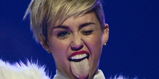 LAS VEGAS, NV - SEPTEMBER 21: Entertainer Miley Cyrus winks and sticks out her tongue as she performs during the iHeartRadio