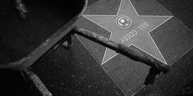 LOS ANGELES, CA - DECEMBER 05: (EDITORS NOTE: Image has been converted to black and white and digitally retouched) A general view is seen of the clean-up of Bill Cosby's star on the Hollywood Walk of Fame after it was defaced with the word 'rapist' on December 5, 2014 in Los Angeles, California. Approximately 20 women have accused Cosby of sexual assault. (Photo by Chris Weeks/Getty Images,)