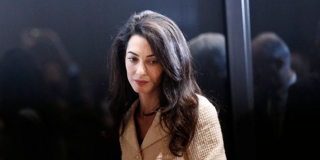 Lawyer Amal Clooney arrives for a press conference at Acropolis Museum in Athens, Wednesday, Oct. 15, 2014. Lawyers Geoffrey Robertson, Norman Palmer and Amal Clooney arrived Monday to Greece on a four-day visit to meet government officials, including Prime Minister Antonis Samaras, and advise on Greece's quest to have the Parthenon Marbles returned to Athens. (AP Photo/Petros Giannakouris)
