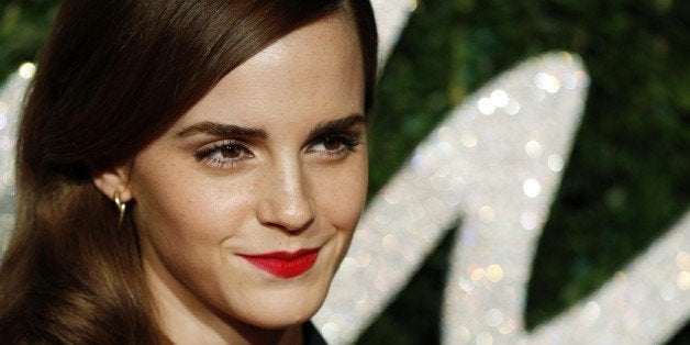 English actress Emma Watson poses for pictures on the red carpet upon arrival to attend the British Fashion Awards 2014 in London on December 1, 2014. AFP PHOTO/JUSTIN TALLIS (Photo credit should read JUSTIN TALLIS/AFP/Getty Images)