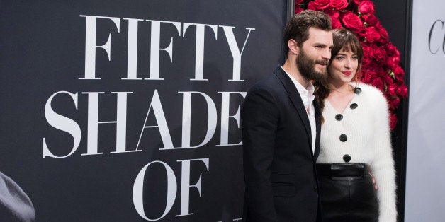 Jamie Dornan and Dakota Johnson attend a special fan screening of "Fifty Shades of Grey" hosted by The Today Show at the Ziegfeld Theatre on Friday, Feb. 6, 2015, in New York. (Photo by Charles Sykes/Invision/AP)