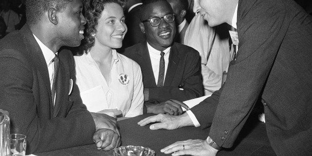Questions about civil rights are discussed by Charles H. Percy, right, chairman of the platform committee of the Republican Party, at Chicago session on July 20, 1960. With him are, left to right, Walter Bradford, Chicago; Diane J. Nash, of Nashville, Tenn., and Bernard Lee, of Montgomery, Ala. (AP Photo)