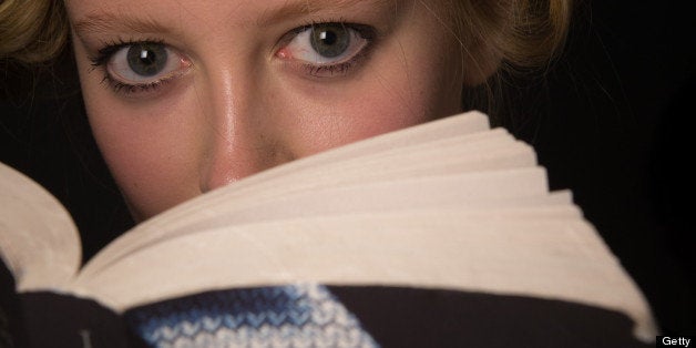 LONDON, ENGLAND - SEPTEMBER 15: A model reads Fifty Shades of Grey backstage ahead of the Jasper Conran show on day 2 of London Fashion Week Spring/Summer 2013, at the Courtyard Show Space on September 15, 2012 in London, England. (Photo by Ian Gavan/Getty Images)