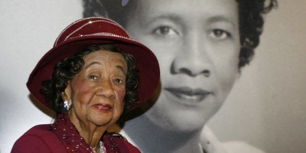 FILE -- In a Feb. 14, 2008 file photo Dorothy Irene Height sits in front of her portrait inside the "Freedom's Sisters" exhibition at the Cincinnati Museum Center, in Cincinnati. Height, who as longtime president of the National Council of Negro Women was the leading female voice of the 1960s civil rights movement, died Tuesday, April 20, 2010. She was 98. (AP Photo/David Kohl/file)