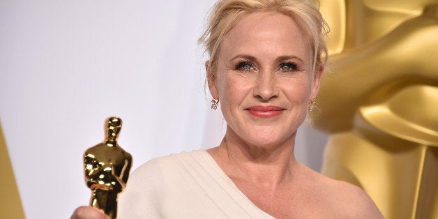 Patricia Arquette poses in the press room with the award for best actress in a supporting role for âBoyhoodâ at the Oscar
