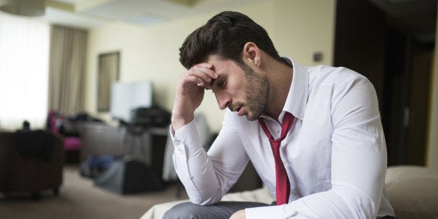 Frustrated young man in hotel roomFrustrated young man in hotel room