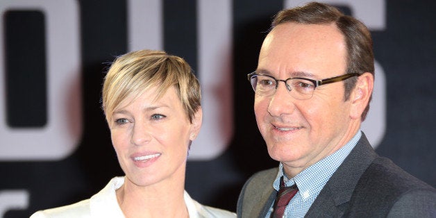 Actors Kevin Spacey and Robin Wright pose for photographers upon arrival at the House of Cards season 3 World Premiere at the