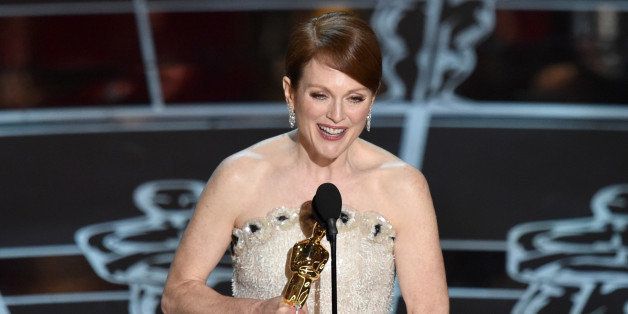 Julianne Moore accepts the award for best actress in a leading role for âStill Alice at the Oscars on Sunday, Feb. 22, 2015, at the Dolby Theatre in Los Angeles. (Photo by John Shearer/Invision/AP)