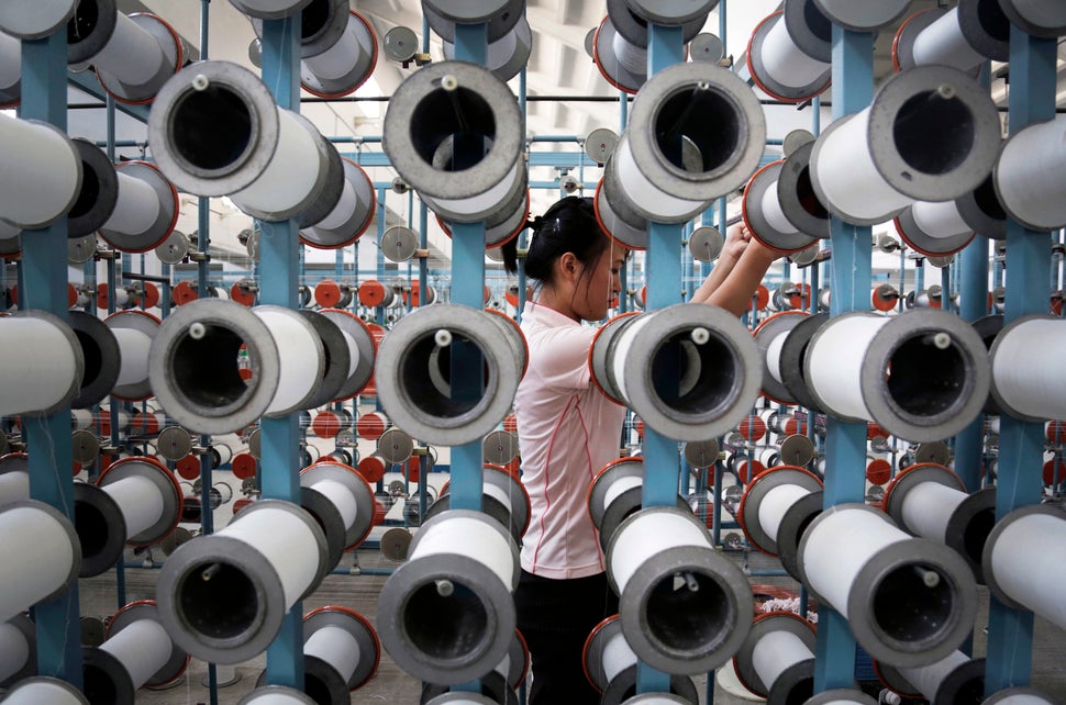 A North Korean woman works at the Kim Jong Suk Pyongyang textile factory, Thursday, July 31, 2014, in Pyongyang, North Korea.