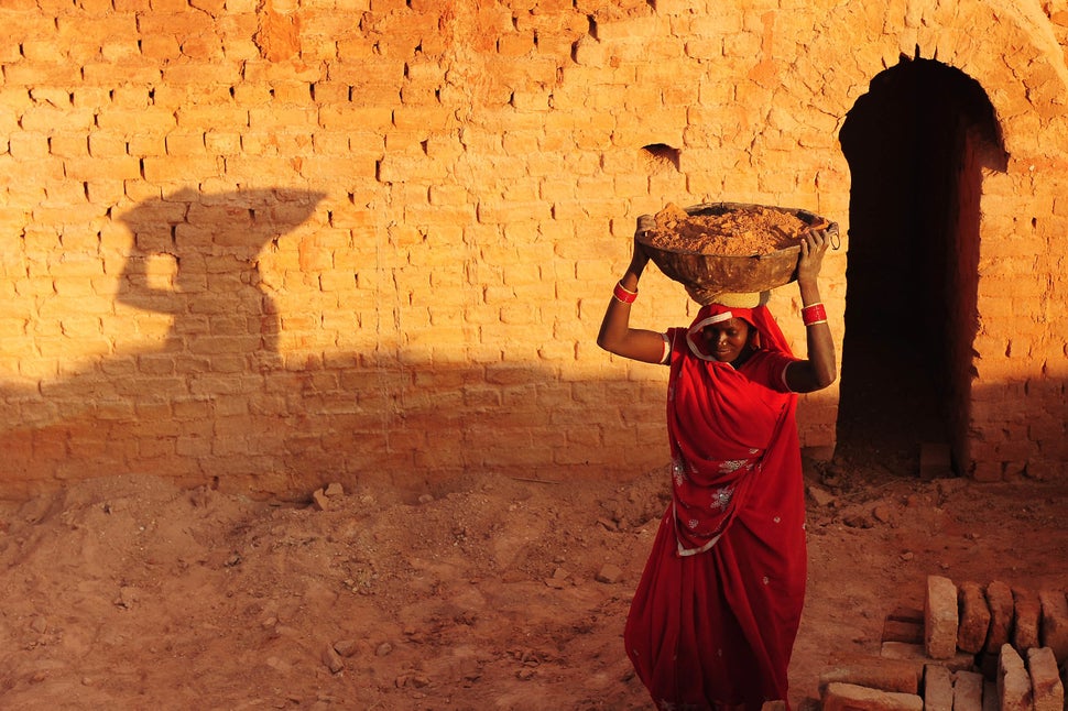 An Indian female laborer works at a brick factory in Allahabad on March 7, 2013. (Sanjay Kanojia/AFP/Getty Images)