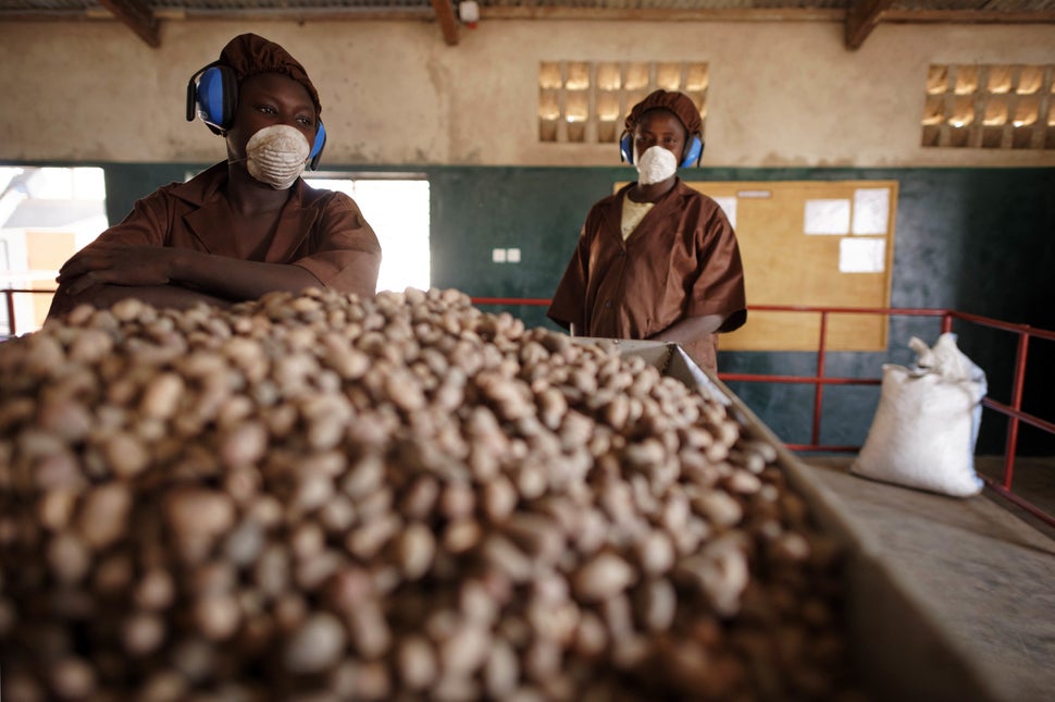 Women pose on a shea butter production line for the French cosmetics company L'Occitane in Leo, south-central Burkina Faso, o