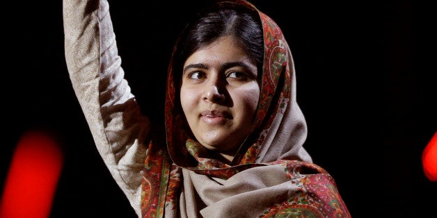 Joint-Nobel Peace Prize winner Malala Yousafzai from Pakistan waves as she arrives to speak on stage during the Nobel Peace P