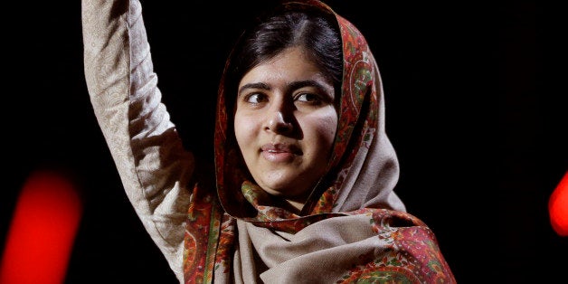 Joint-Nobel Peace Prize winner Malala Yousafzai from Pakistan waves as she arrives to speak on stage during the Nobel Peace Prize Concert in Oslo, Norway, Thursday, Dec. 11, 2014. Malala Yousafzai from Pakistan and Kailash Satyarthi of India received the Nobel Peace Prize on Wednesday for risking their lives to help protect children from slavery, extremism and forced labor at great risk to their own lives. (AP Photo/Matt Dunham)