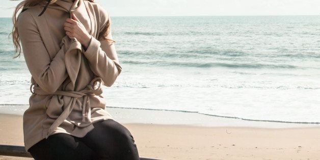 Portrait of young woman at beach, Bournemouth, Dorset, UK