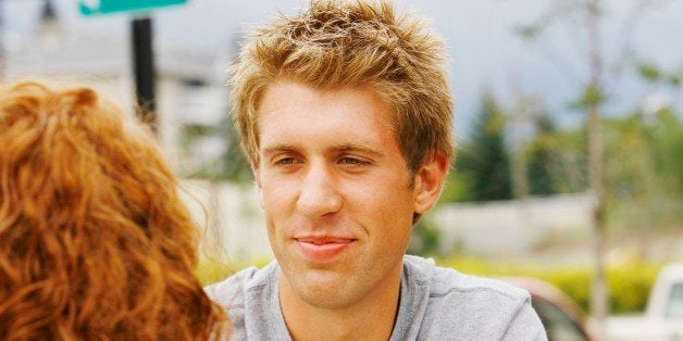 Man looking at woman at outdoor cafe