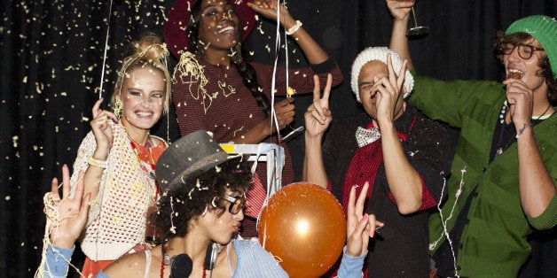 Friends dancing together at party