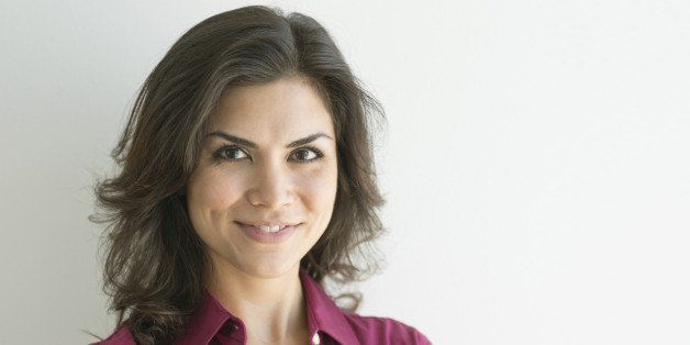 Mixed race businesswoman smiling