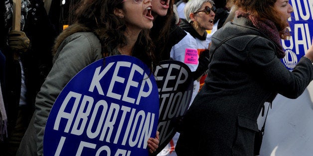 WASHINGTON, DC - JAN 22: There were heated exchanges between pro-choice (pictured) rally goers and anti-abortion protestors in front of the Supreme Court. Thousands of anti-abortion protestors rallied on the mall and marched (up Constitution Ave.) the Supreme Court to show their displeasure with the Roe V Wade decision. (Photo by Michael S. Williamson/The Washington Post via Getty Images