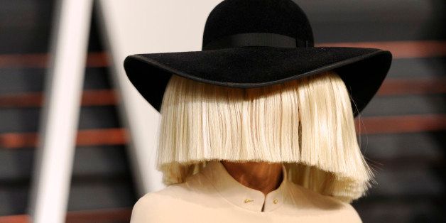 Sia arrives at the 2015 Vanity Fair Oscar Party on Sunday, Feb. 22, 2015, in Beverly Hills, Calif. (Photo by Evan Agostini/Invision/AP)