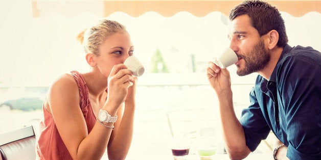 Young couple drink coffee at italian café