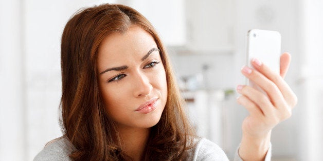 Pretty young woman using mobile phone