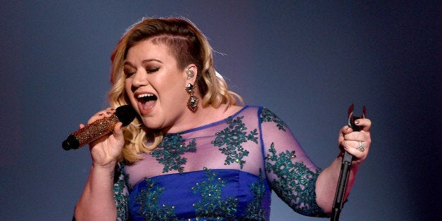 LOS ANGELES, CA - MARCH 29: Singer Kelly Clarkson performs 'Heartbeat Song' onstage during the 2015 iHeartRadio Music Awards