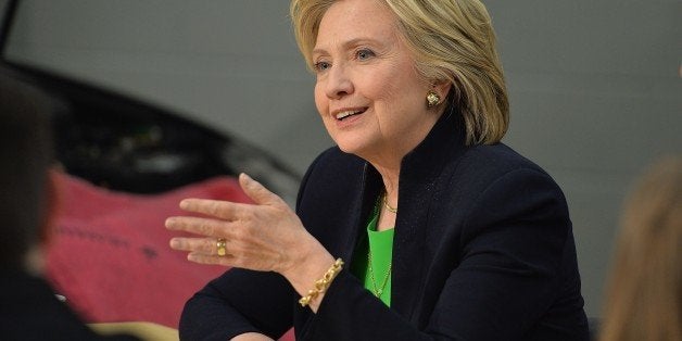Hillary Rodham Clinton participates in a roundtable discussion with students and educators during a campaign event at the Ki