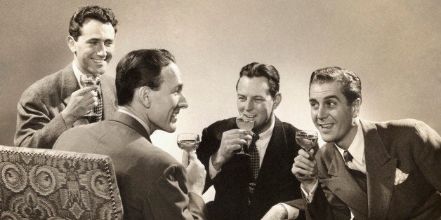 Group of Seated Men Holding Drinks