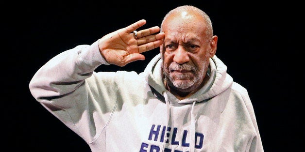 FILE - In this Jan. 17, 2015 file photo, comedian Bill Cosby salutes the crowd as he begins a performance at the Buell Theate