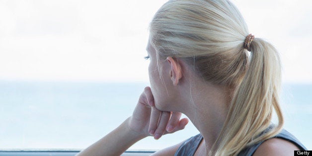 Woman looking out window