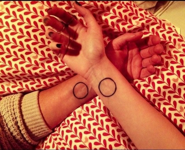 <em>"To celebrate her 18th birthday, my daughter wanted to get a matching tattoo with me. We decided on an open circle to sym