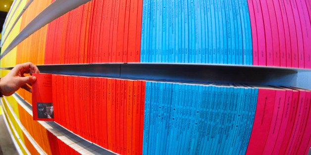 Colorful small books are seen on a shelf on the first day of the Book Fair in Frankfurt, Germany, Wednesday, Oct. 10, 2012. N