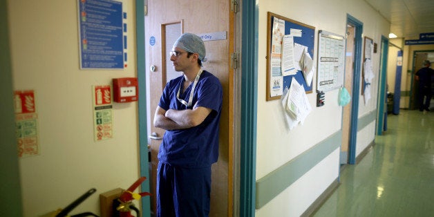 BIRMINGHAM, ENGLAND - JANUARY 22: Editors Note: This image may have been digitally manipulated for confidentiality to remove any patient identidy data. Theatre staff prepare to go in the operating theatre at Birmingham Women's Hospital on January 22, 2015 in Birmingham, England. Birmingham Womens Hospital provides a range of health services to women and their families using the latest scientific procedures and care. Last year the maternity unit delivered over 8,000 babies, cared for 50,000 patients and performed over 3000 procedures in its state of the art theatres. The hospital is also home to world renowned research scientists, fertility clinic and the national sperm bank. (Photo by Christopher Furlong/Getty Images)