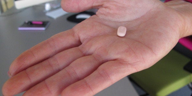In this Friday, Sept. 27, 2013, photo, Cindy Whitehead holds a tablet of flibanserin in her office at Sprout Pharmaceuticals