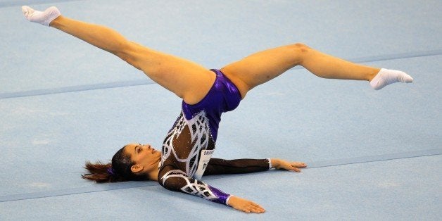 Farah Ann Abdul Hadi of Malaysia competes during the women's floor excercise routine final at the 28th Southeast Asian Games (SEA Games) in Singapore on June 10, 2015. AFP PHOTO / MOHD FYROL (Photo credit should read MOHD FYROL/AFP/Getty Images)